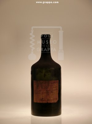 Bottiglia con etichetta scritta a mano da Maria Corrà Poli
